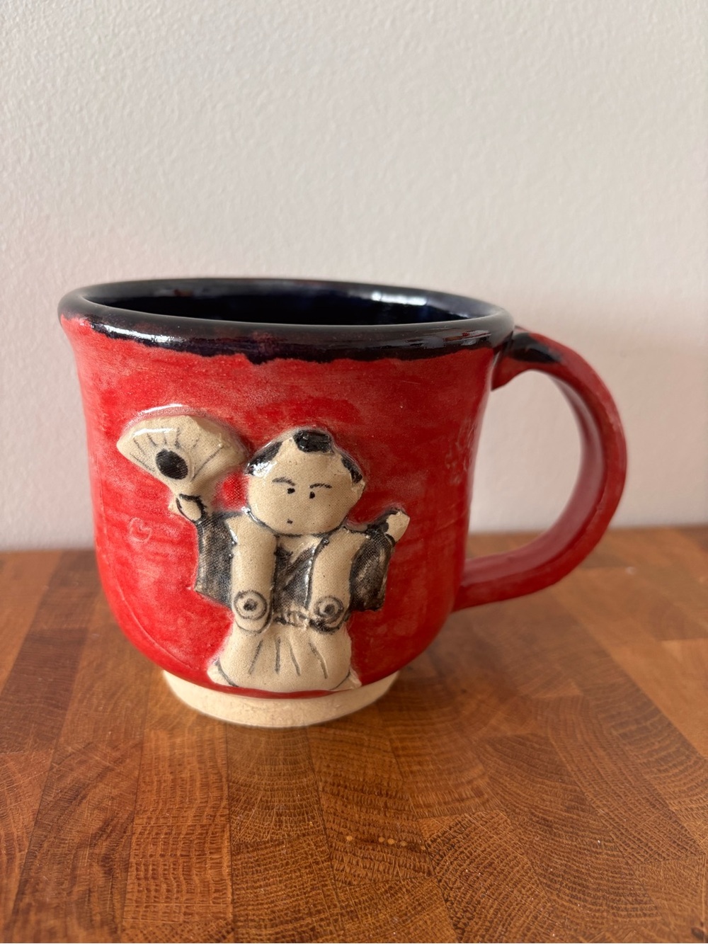 Handcrafted Red Ceramic Mug with Samurai Figure